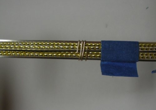 Judy Larson's Two-tone Beaded Bangle - , Classic Wire Jewelry, Wire Wrapping, Wrapping, Wire Wrapping Jewelry,  Fan the wire tails to the sides so they will be covered in the next step with the wire wraps. 